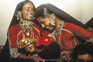 susana millman India tribal travel photo of rabari girls laughing before wedding ceremony Gujurat India