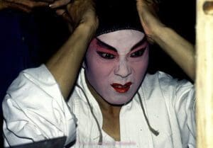 susana millman travel photo of chinese opera performer doing makeup before show
